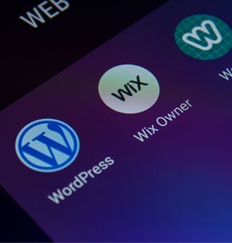 Screenshot of a mobile screen showcasing the Wix, Weebly, and WordPress apps