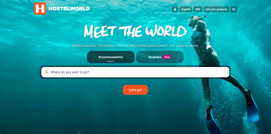 Hostel World homepage: background underwater scene of someone snorkeling and a search bar