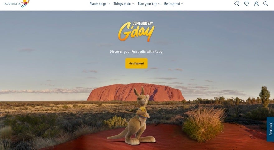 Visit Australia homepage: landscape of Uluru and an animated kangaroo in the foreground