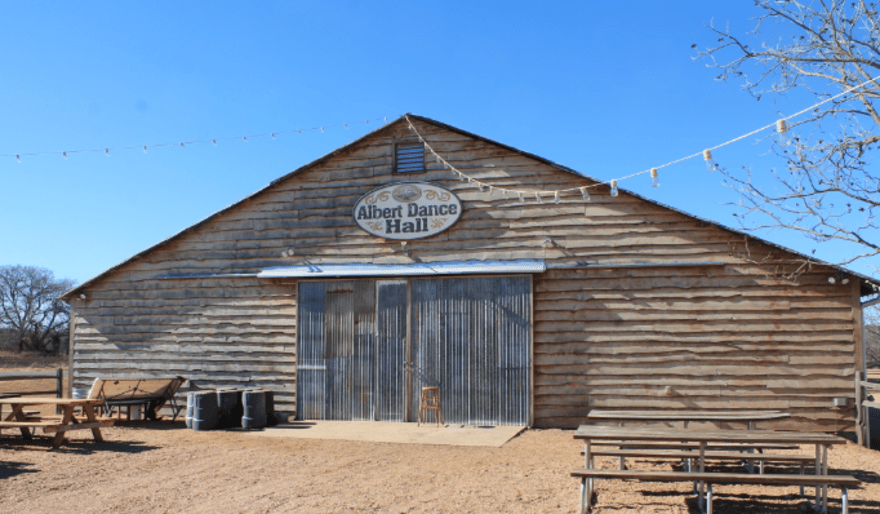 The Albert town dance hall, wooden building surrounded by dry land