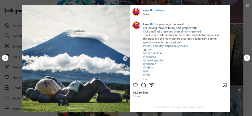 A post on KAWS' Instagram page, which is a photo of a large sculpture lying down in front of a mountain