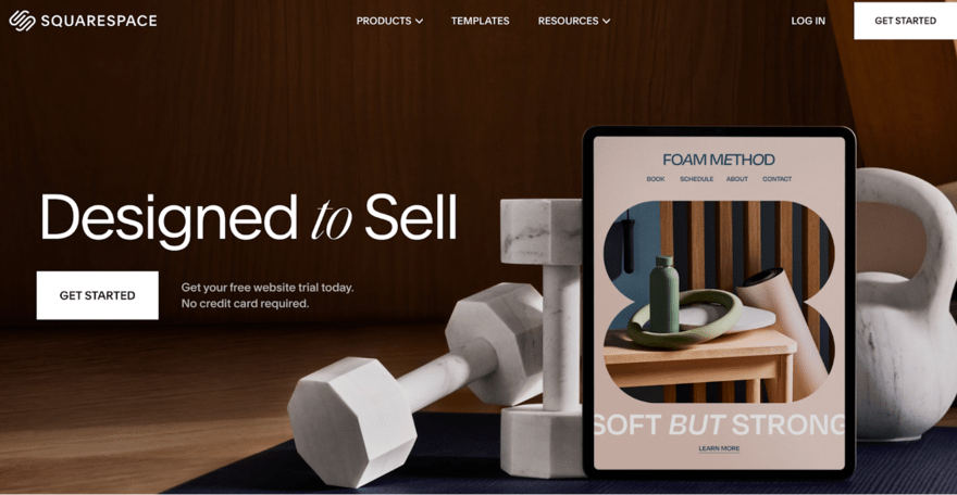 Image of a Squarespace homepage mockup featuring a tablet with an open book and a water bottle on a table. Text overlay promotes website building tools and a free trial.