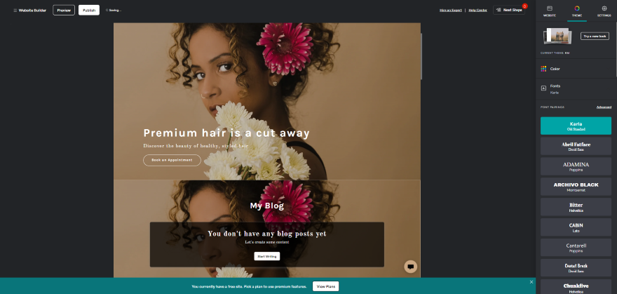 A screenshot showing a website design in GoDaddy editor with a floral hair salon theme