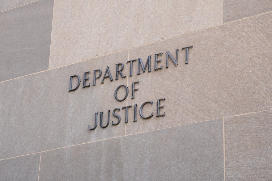 Wall with "Department of Justice" displayed on the side